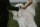 groom holding brides dress