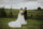 bride and groom in a field