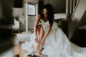 bride putting her shoes on