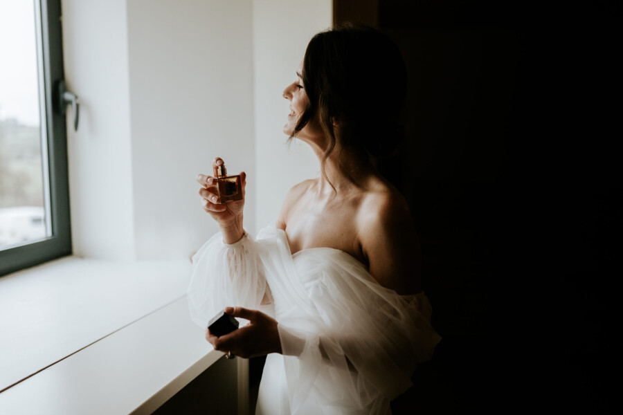 bride using perfume
