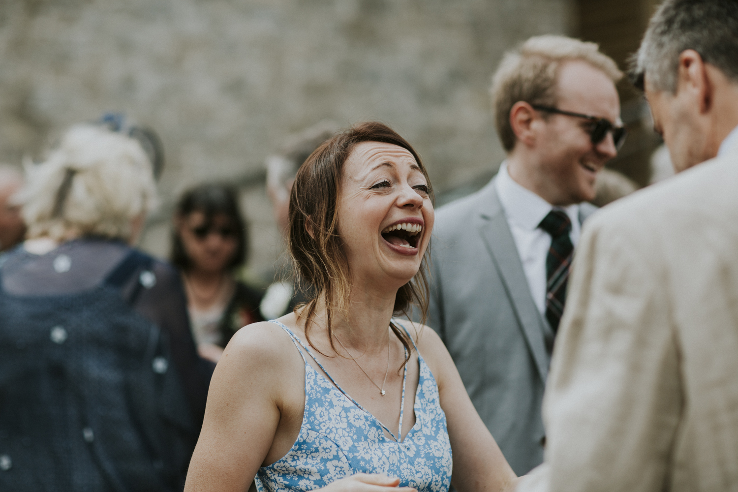 wedding guest laughing