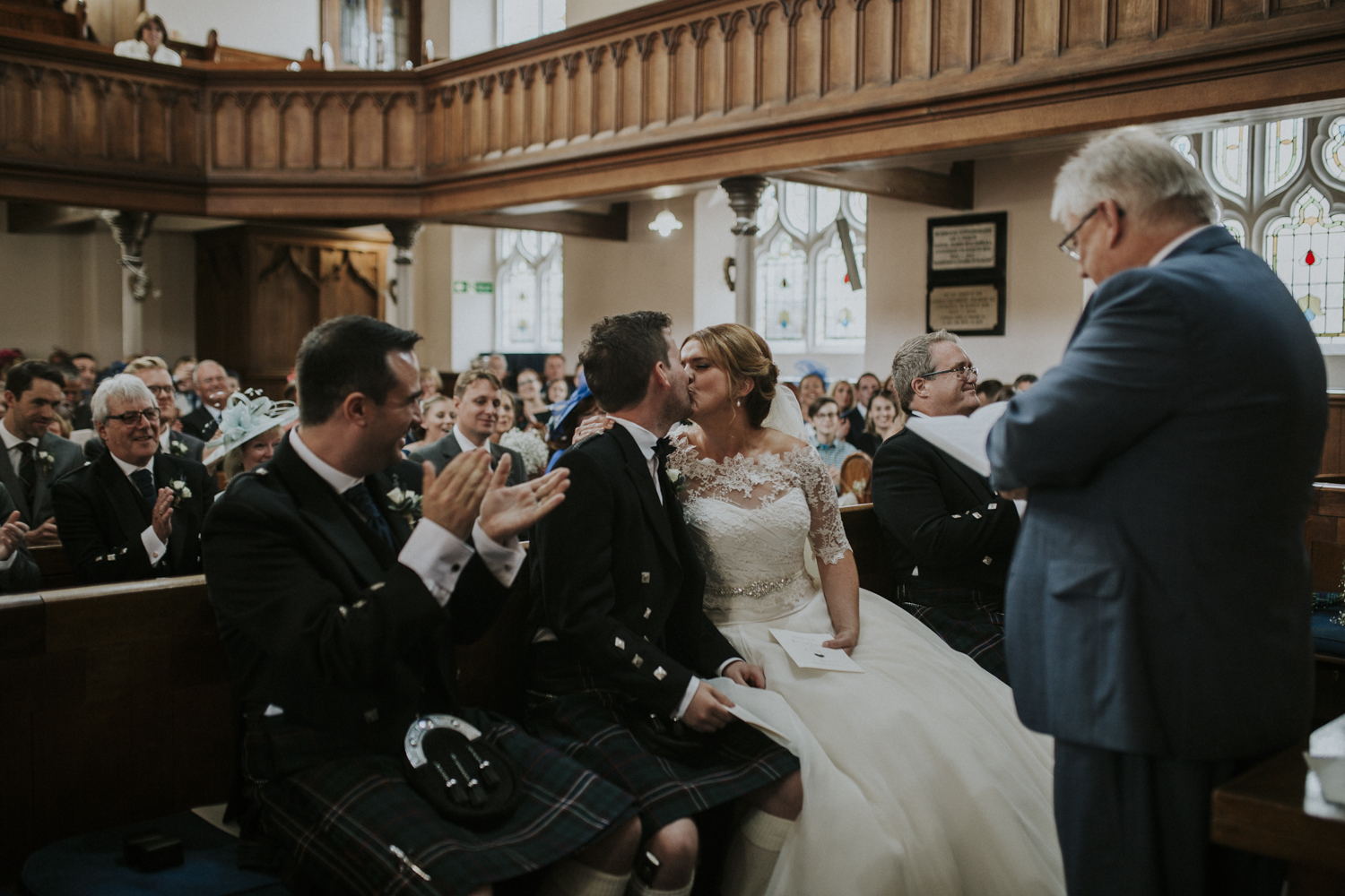 bride and groom first kiss