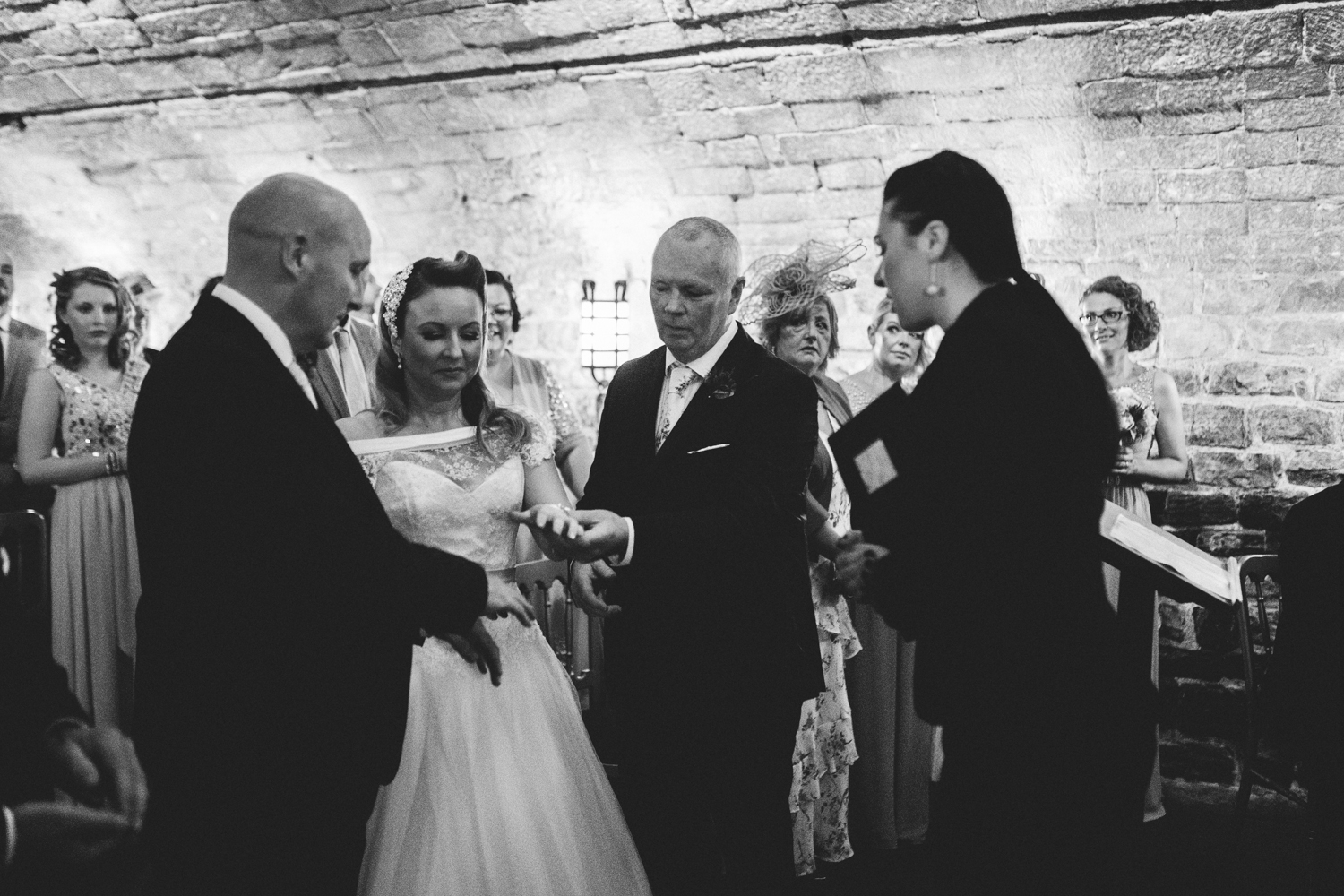 father giving bride to groom