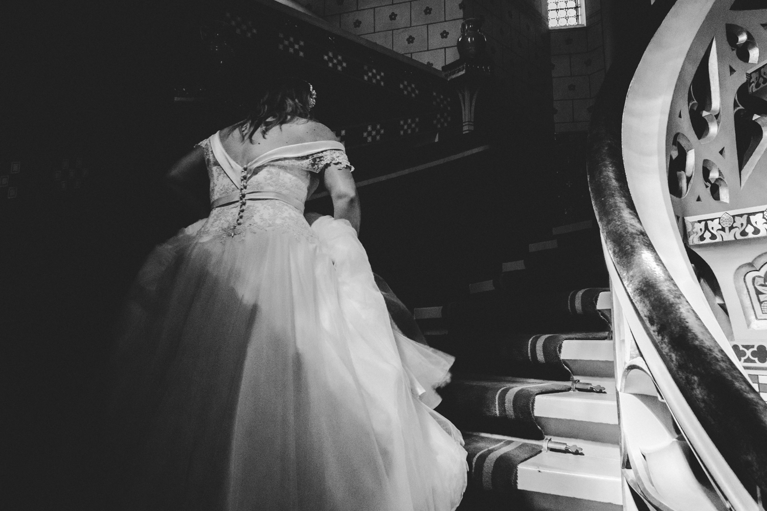 bride walking up cardiff castle staircase