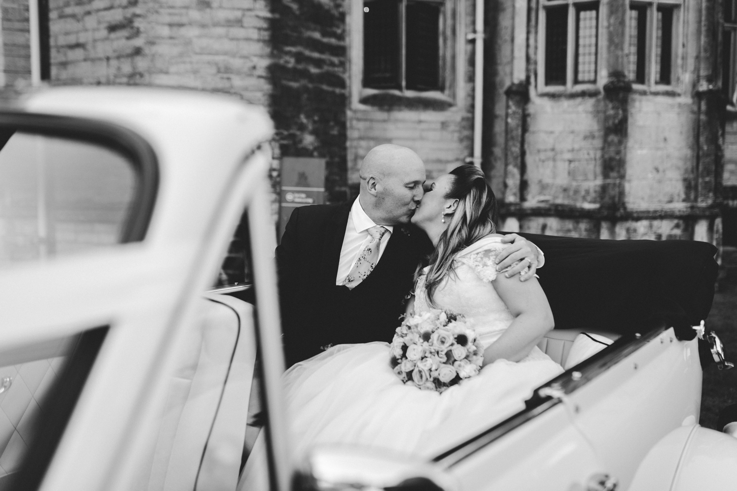 bride and groom in the wedding car