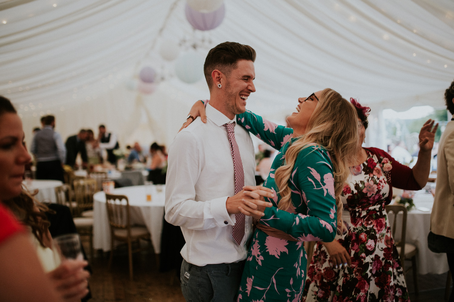 happy wedding guests dancing