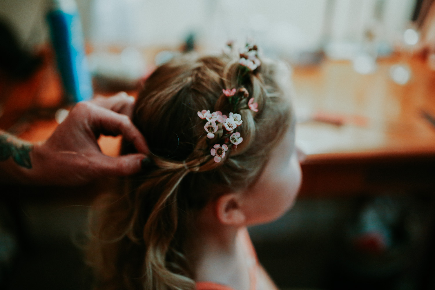 daughter of the bride having her hair done
