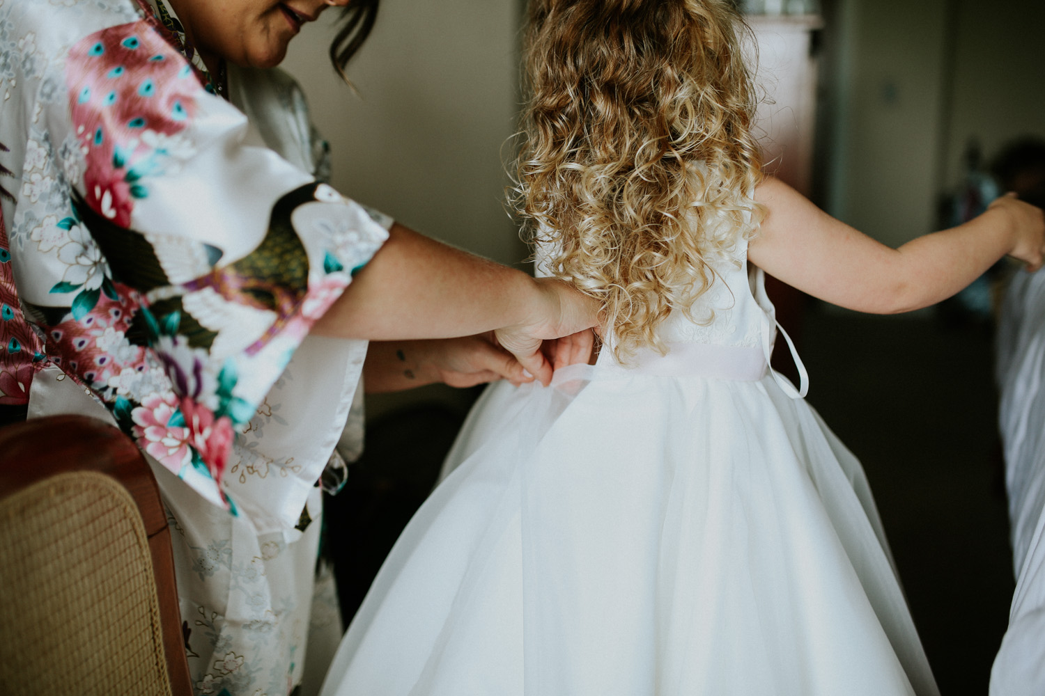 bride dressing daughter