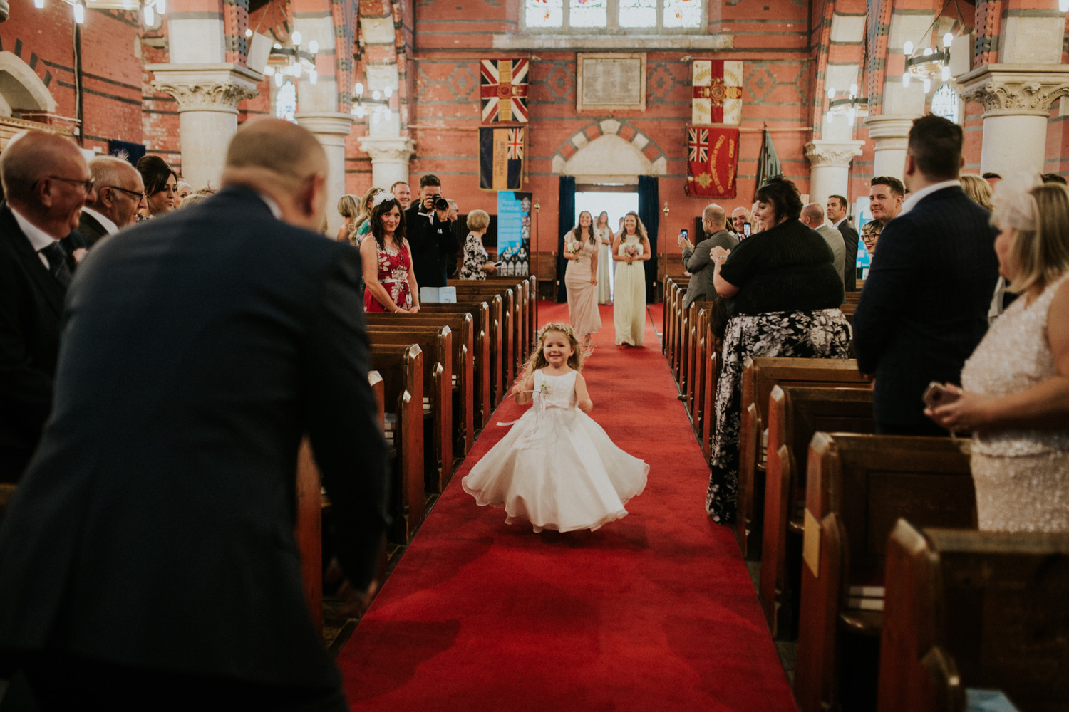daughter running to dad down the isle