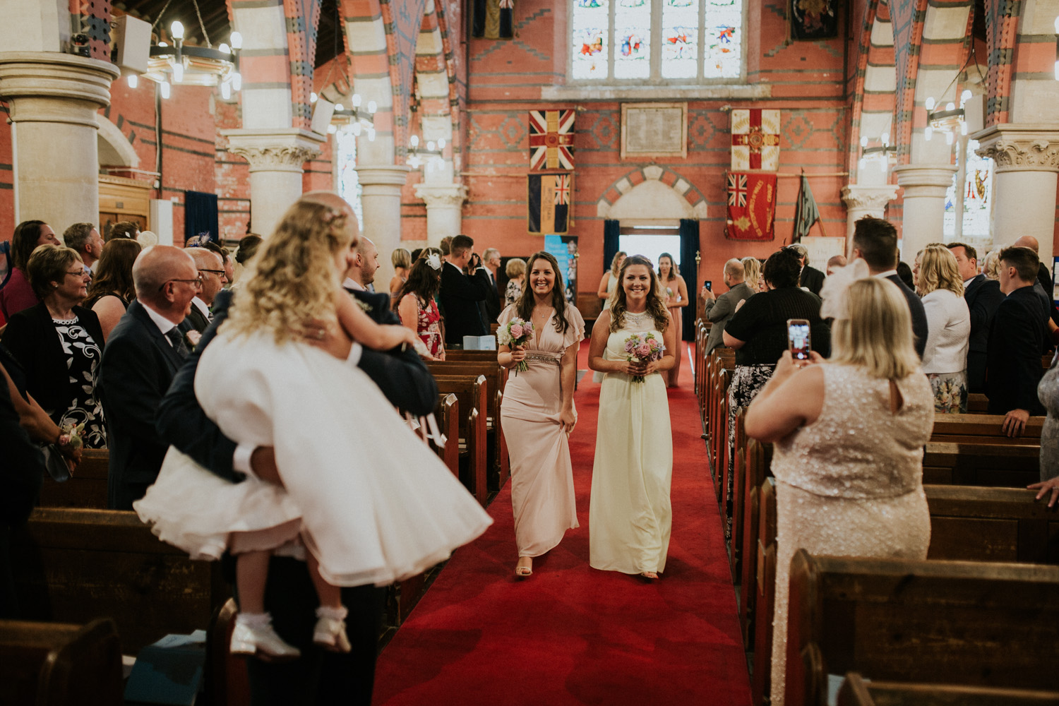 bridesmaids coming down the isle