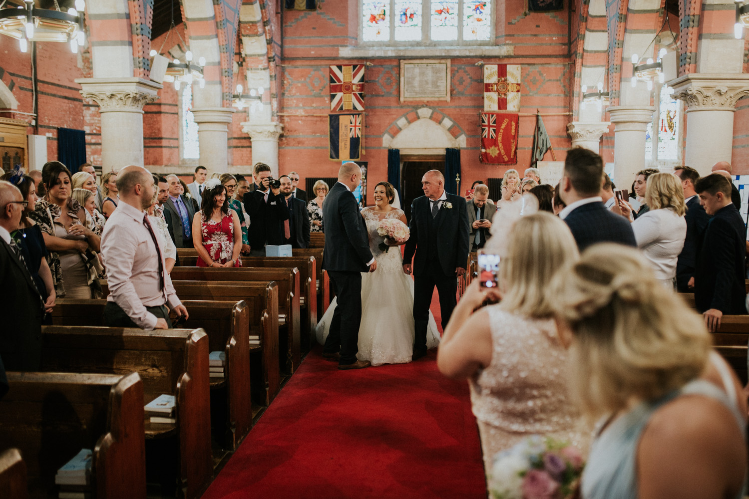 bride and dad walking down the isle