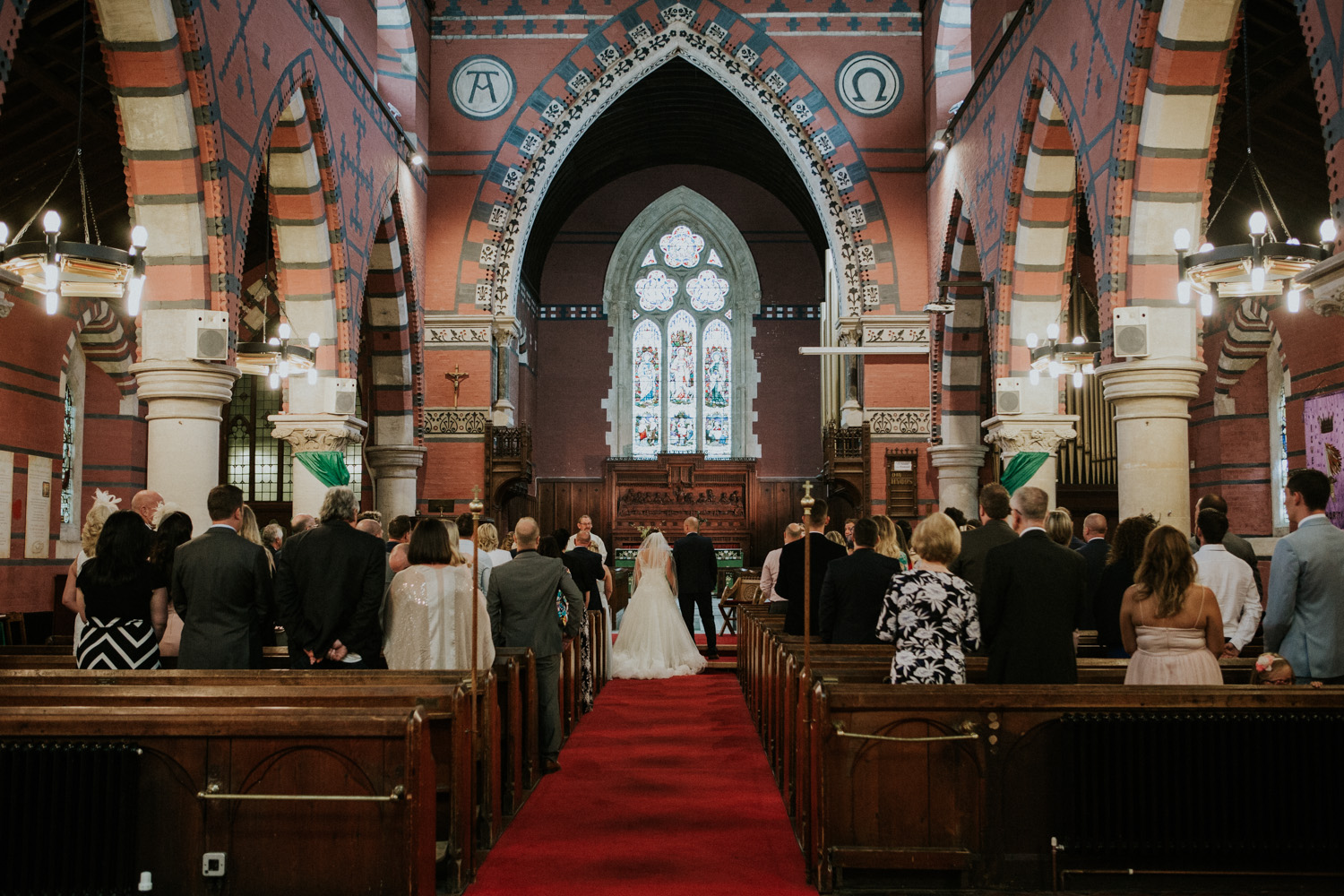 bride and groom in the ceremony from the back