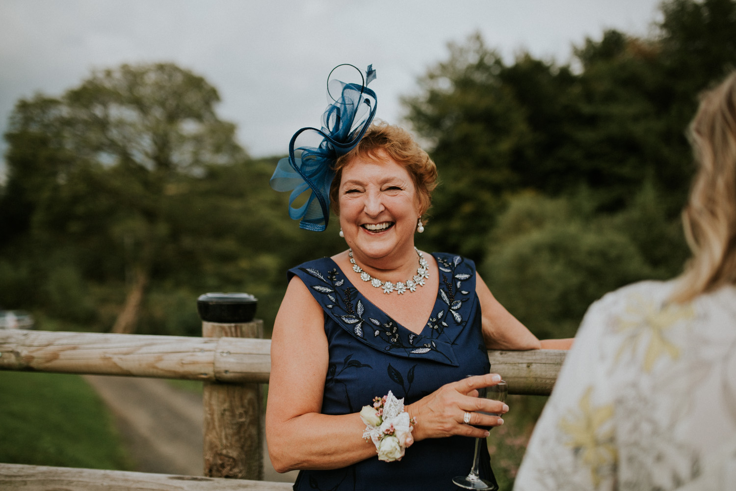 mother of the groom laughing