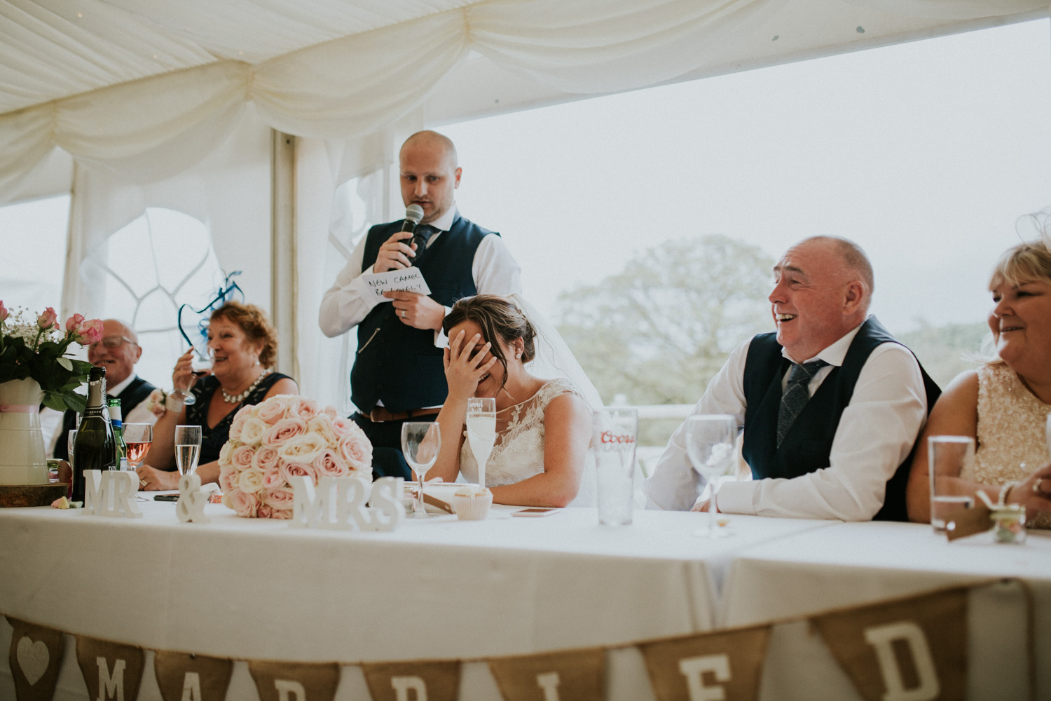 bride laughing and grooms speech