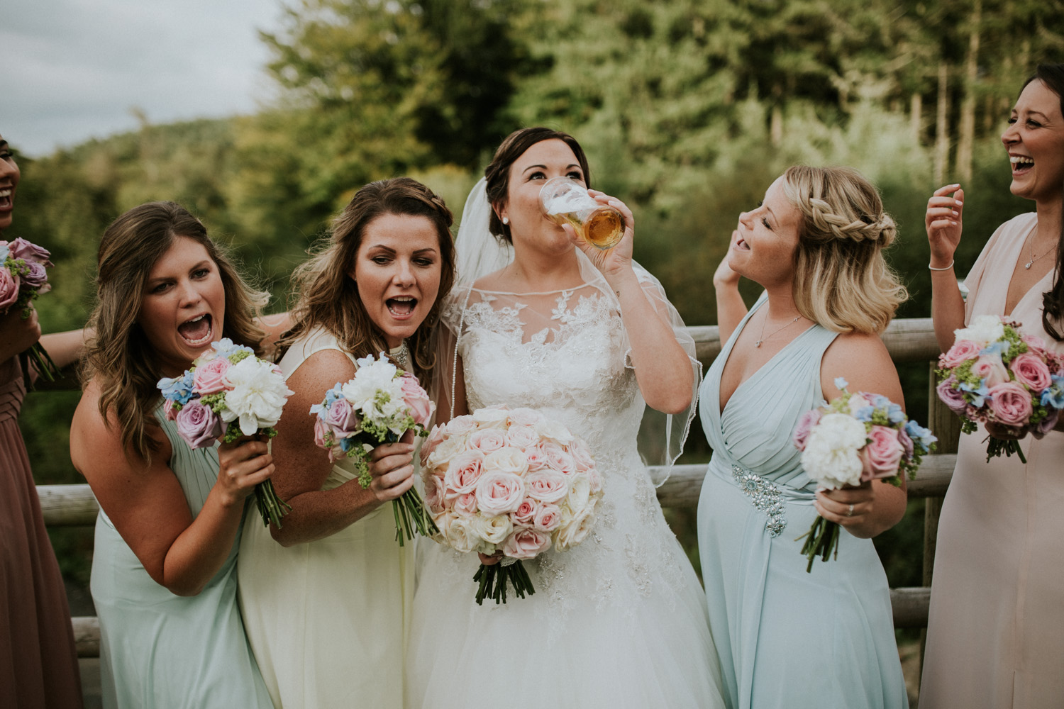 bride and bridesmaids being silly