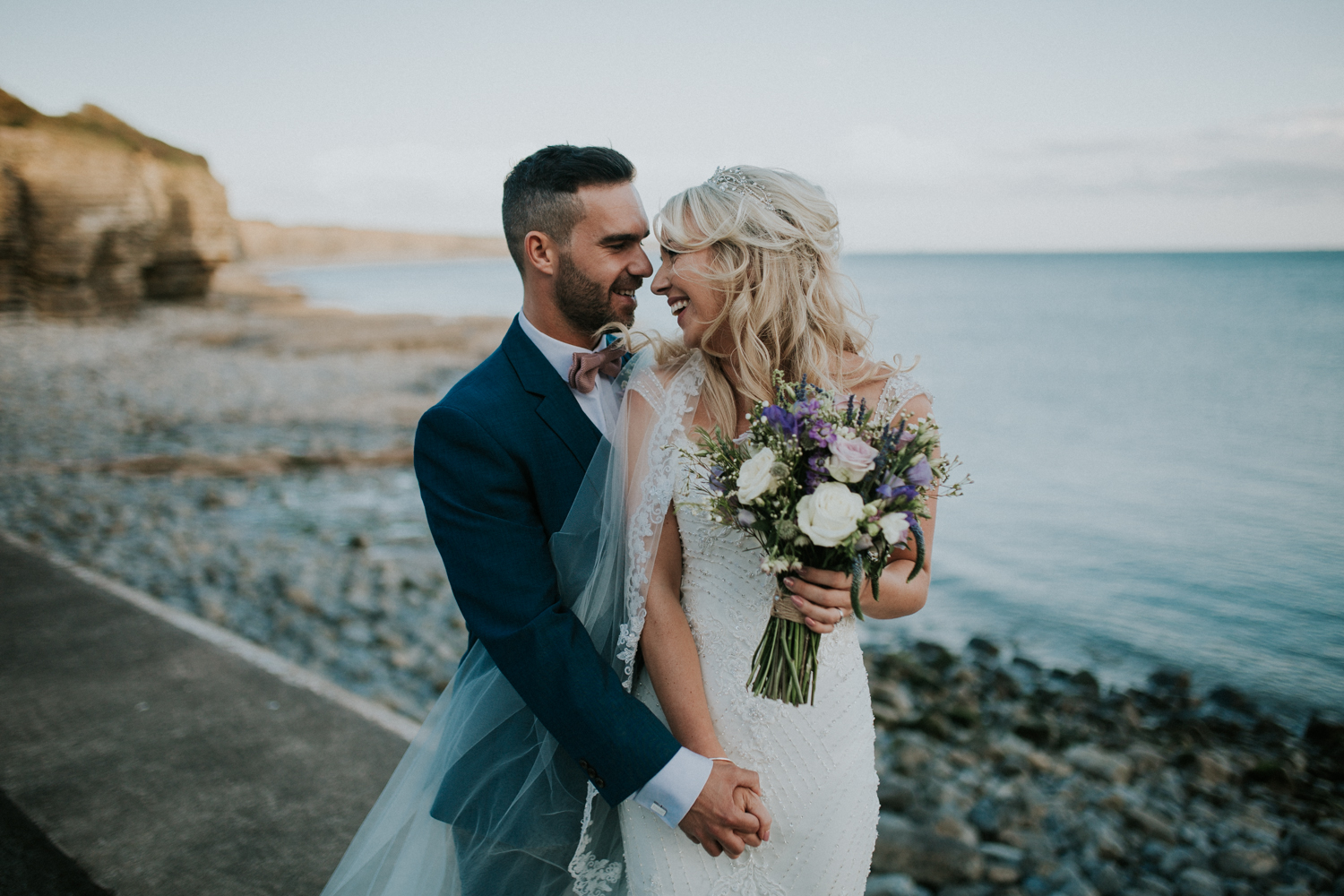 bride and groom at the beach