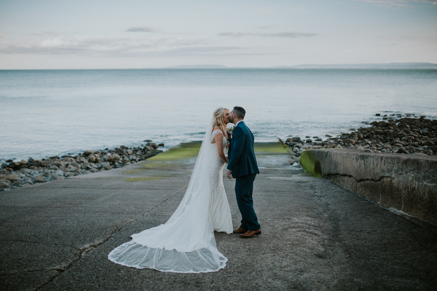 bride and groom at the beach