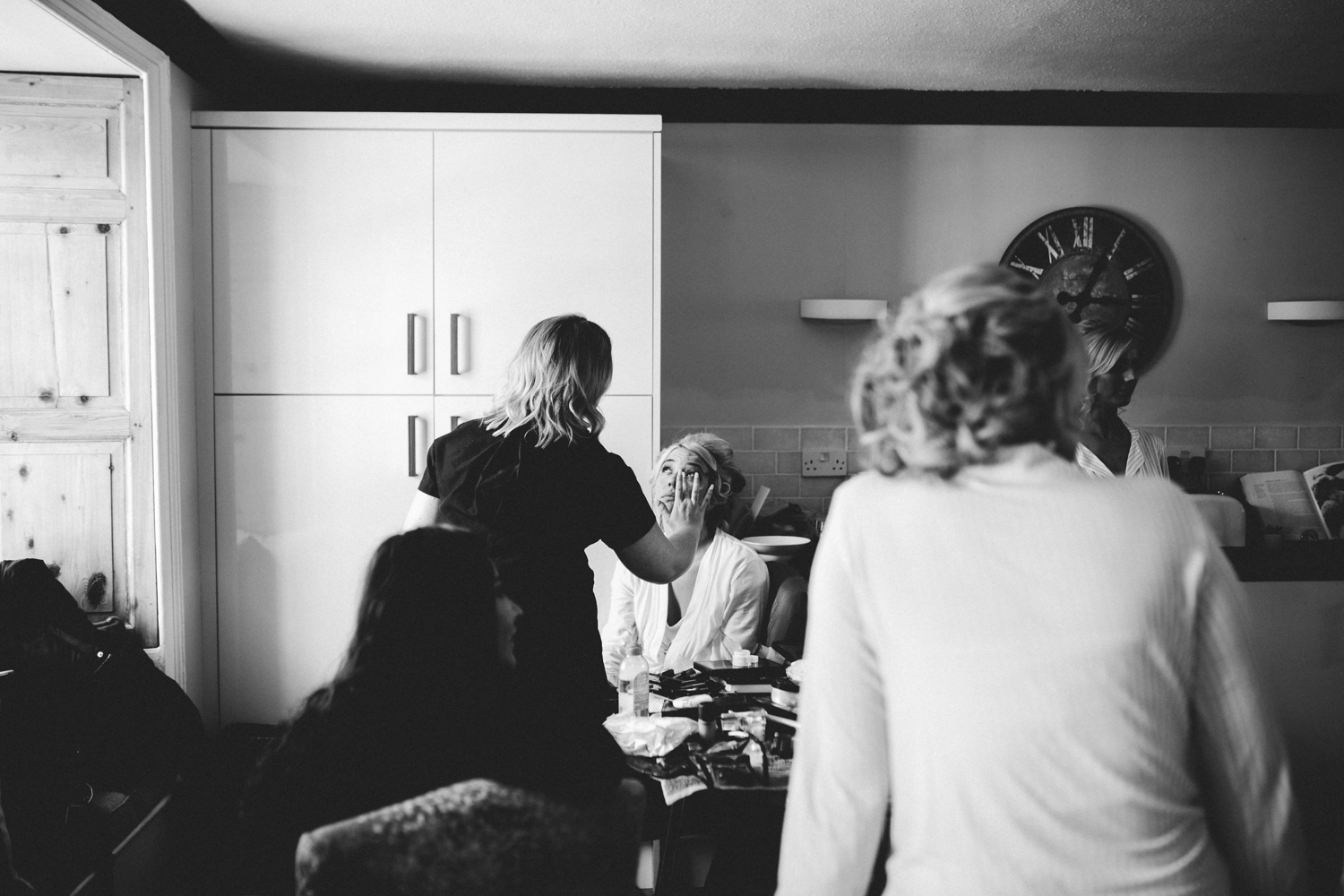 bride having her make -up done