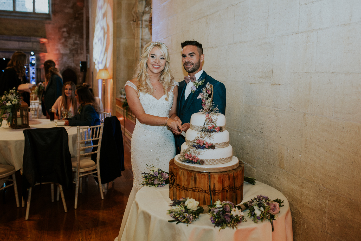 bride and groom cutting the cake