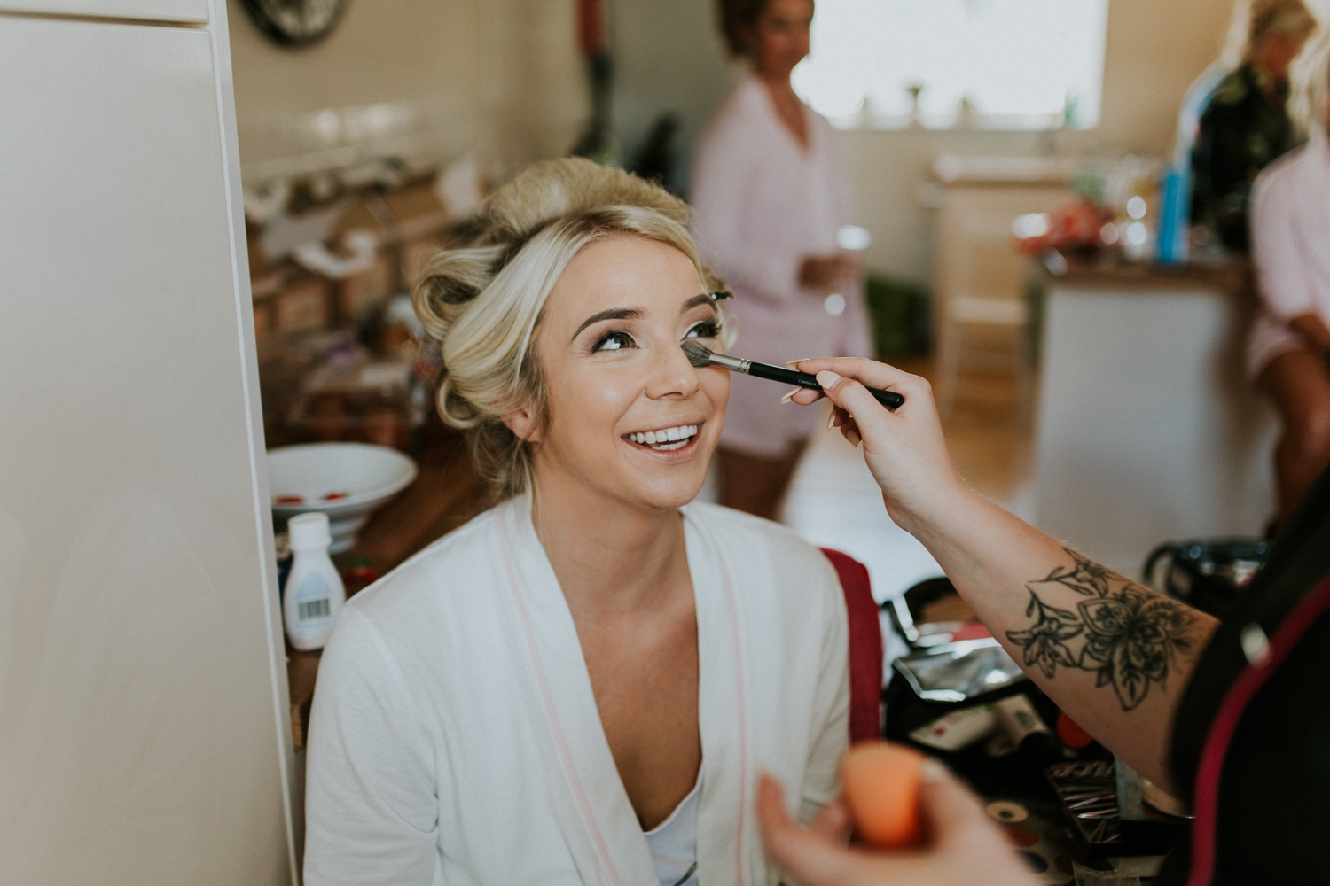 bride having her make-up done