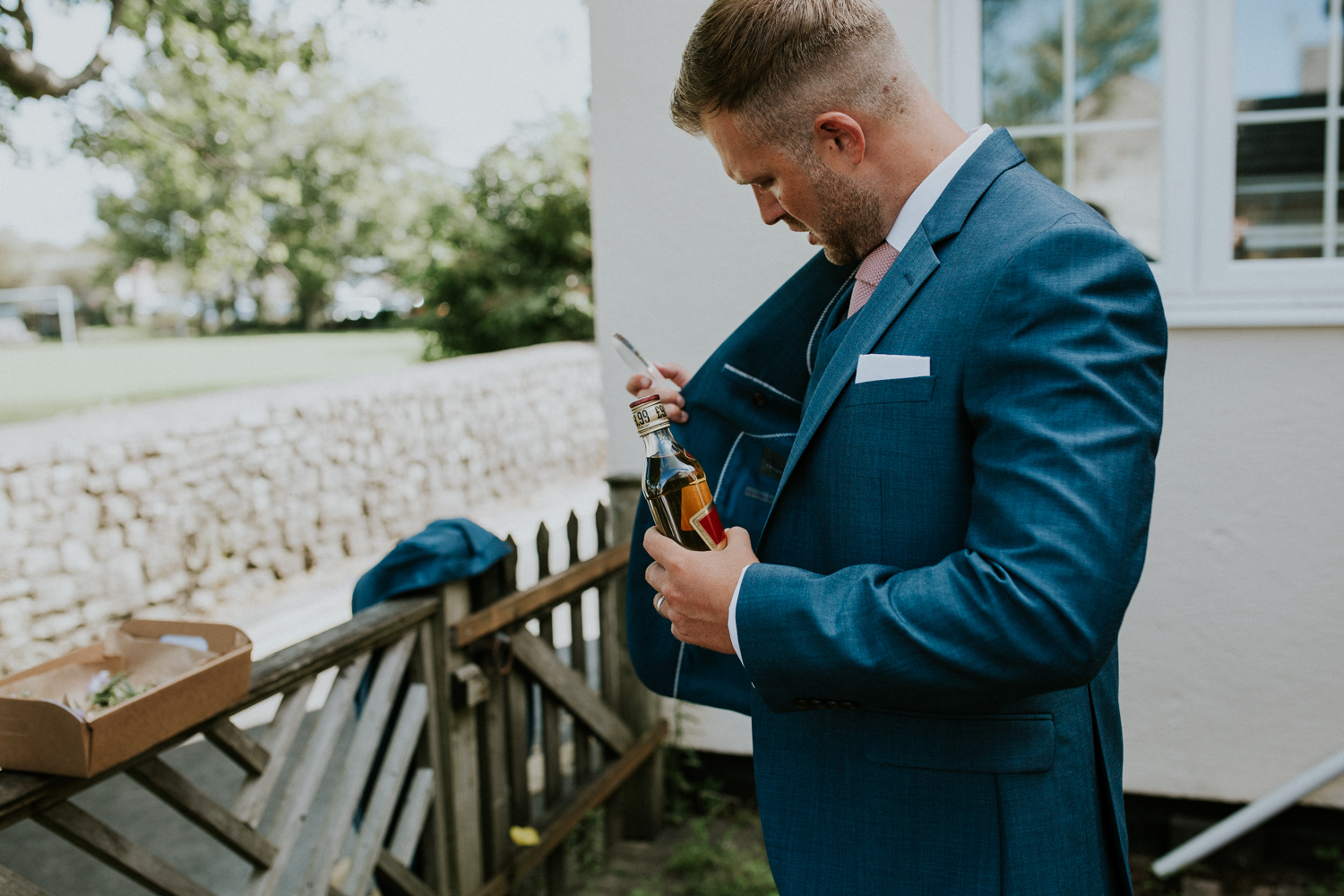 groom with hip flask