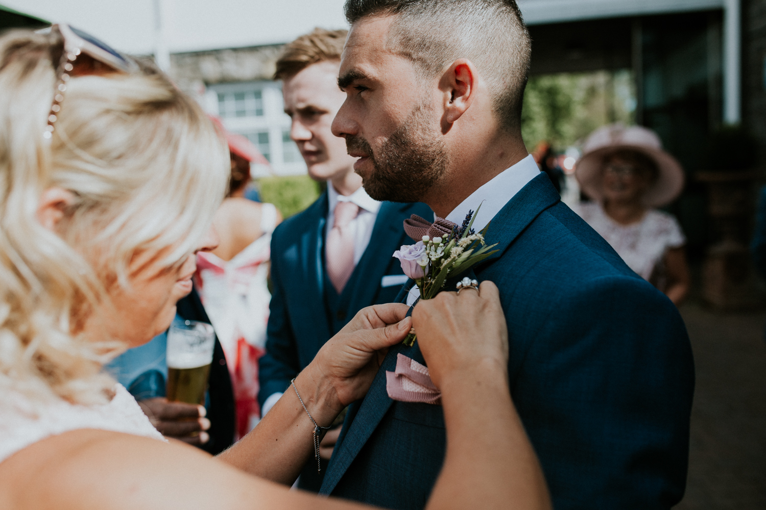 groom putting on his flower