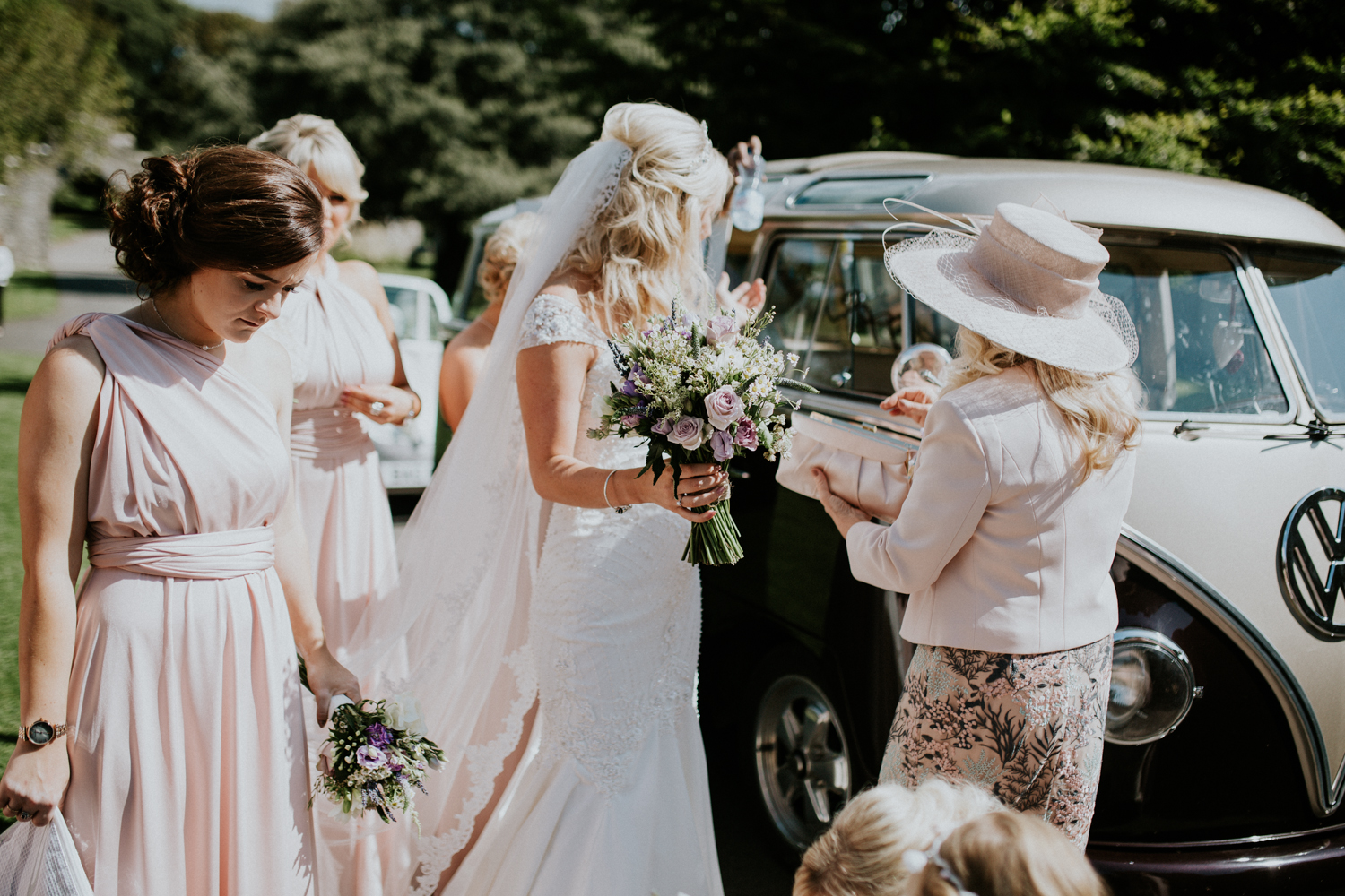 bride getting out of the wedding car