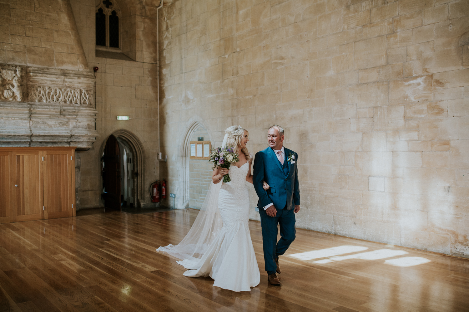 bride and father walking down the isle