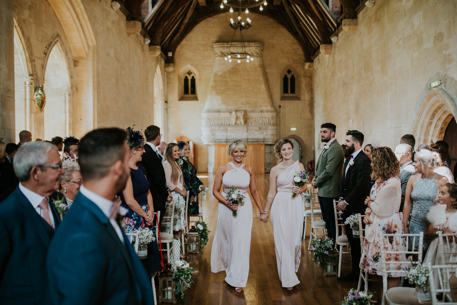 bridesmaids walking down the isle