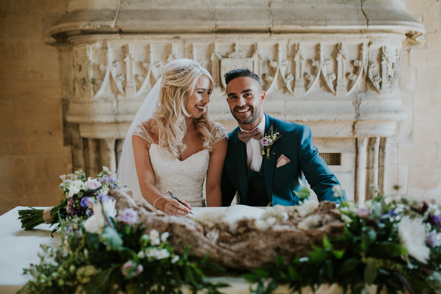 bride and groom signing