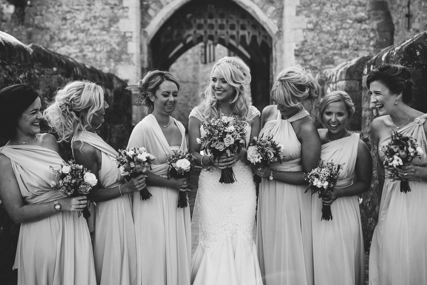 bride and bridesmaids laughing