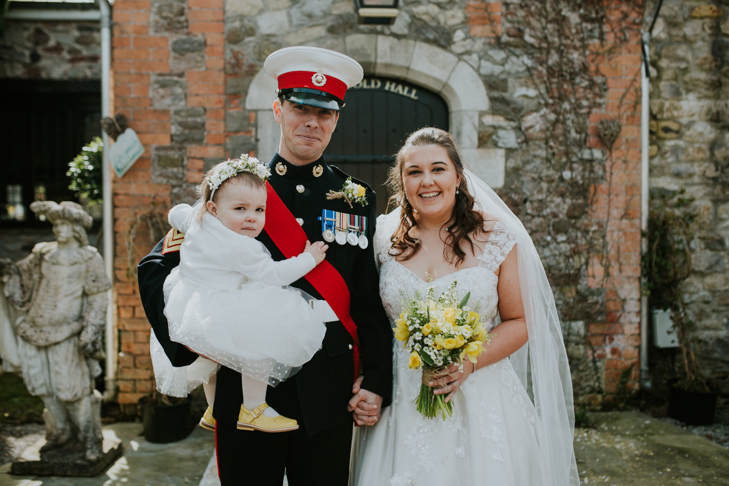 bride, groom and daughter