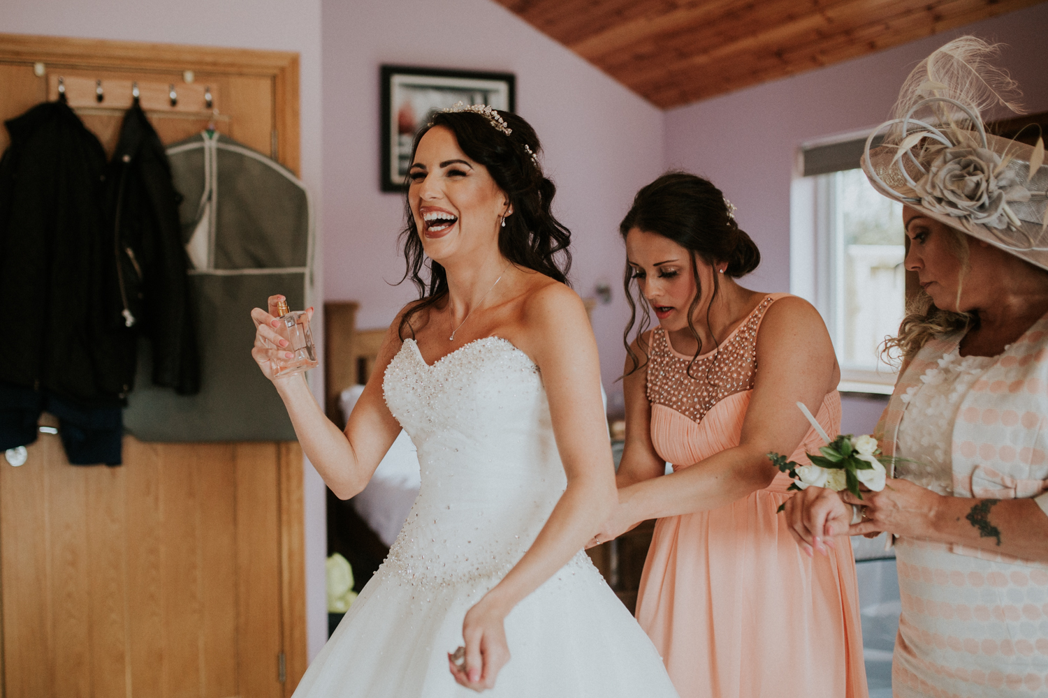 bride spraying perfume