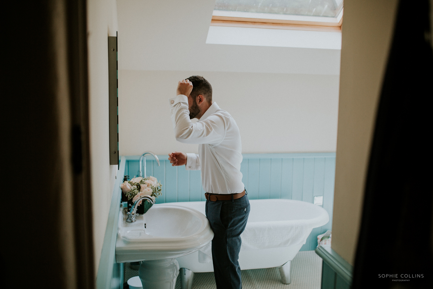 groom doing his hair