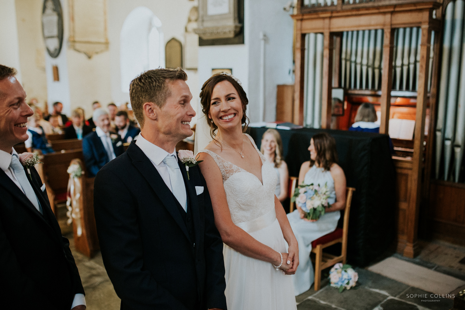 bride and groom smiling 