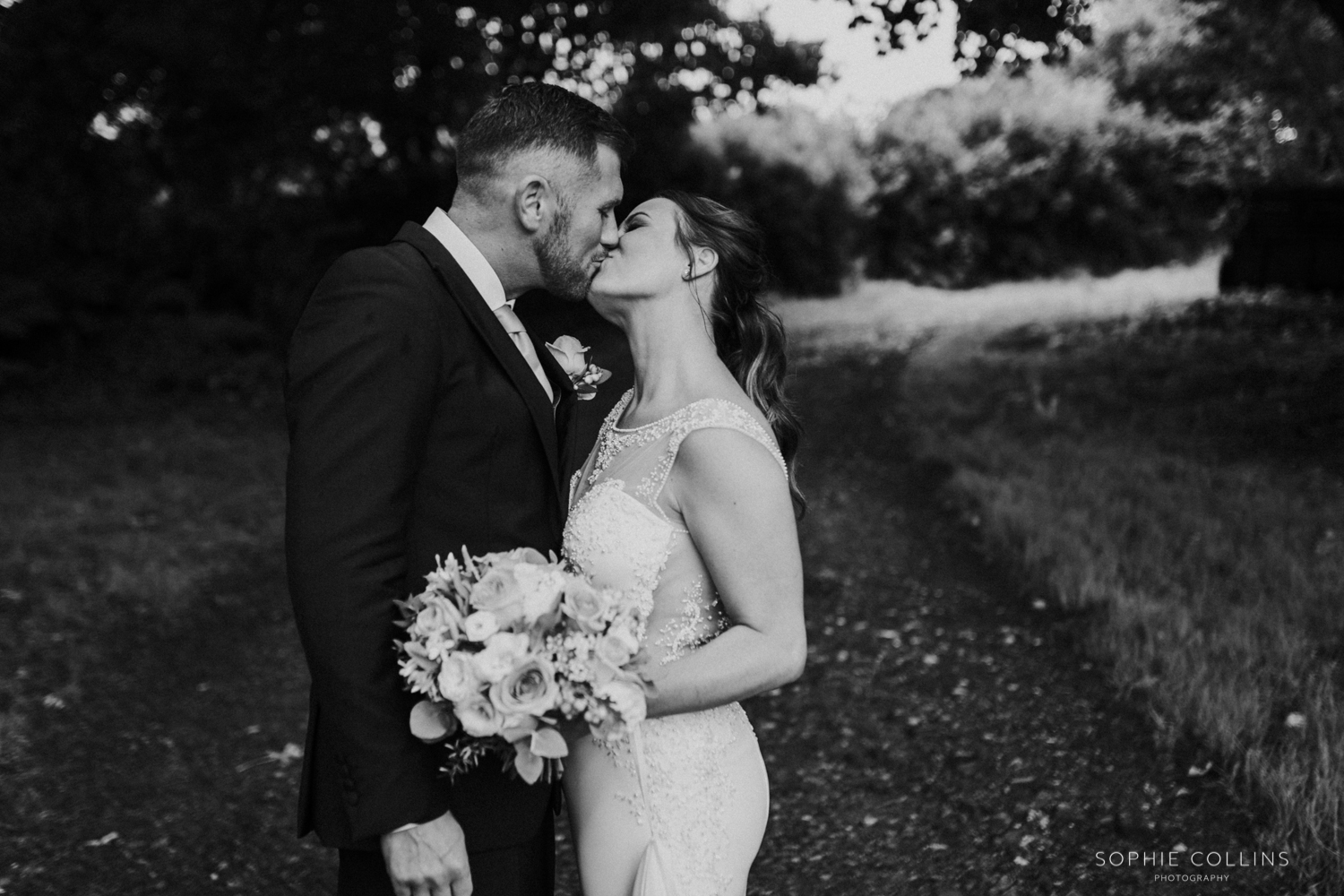 bride and groom kiss