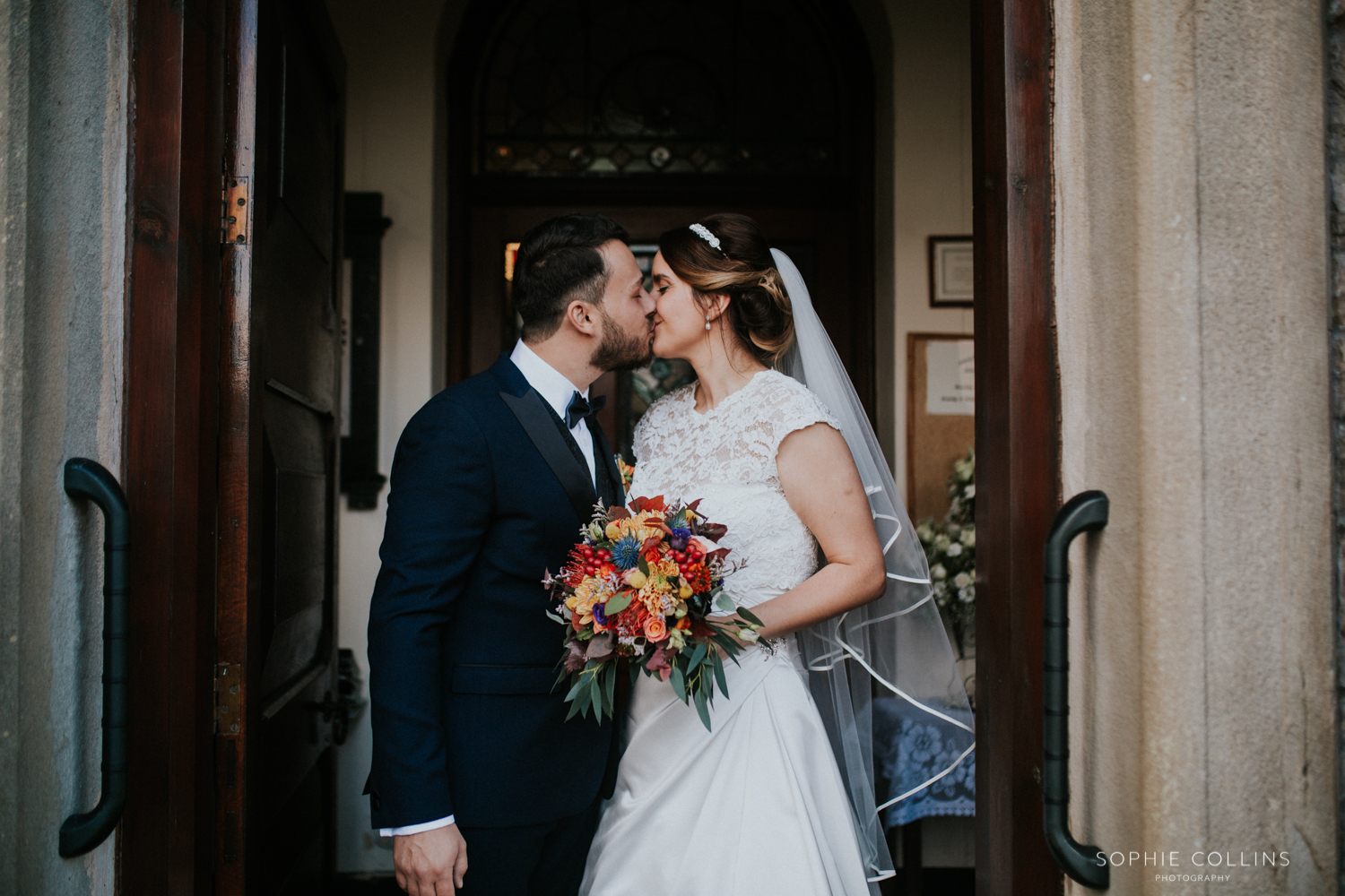 bride and groom kissing