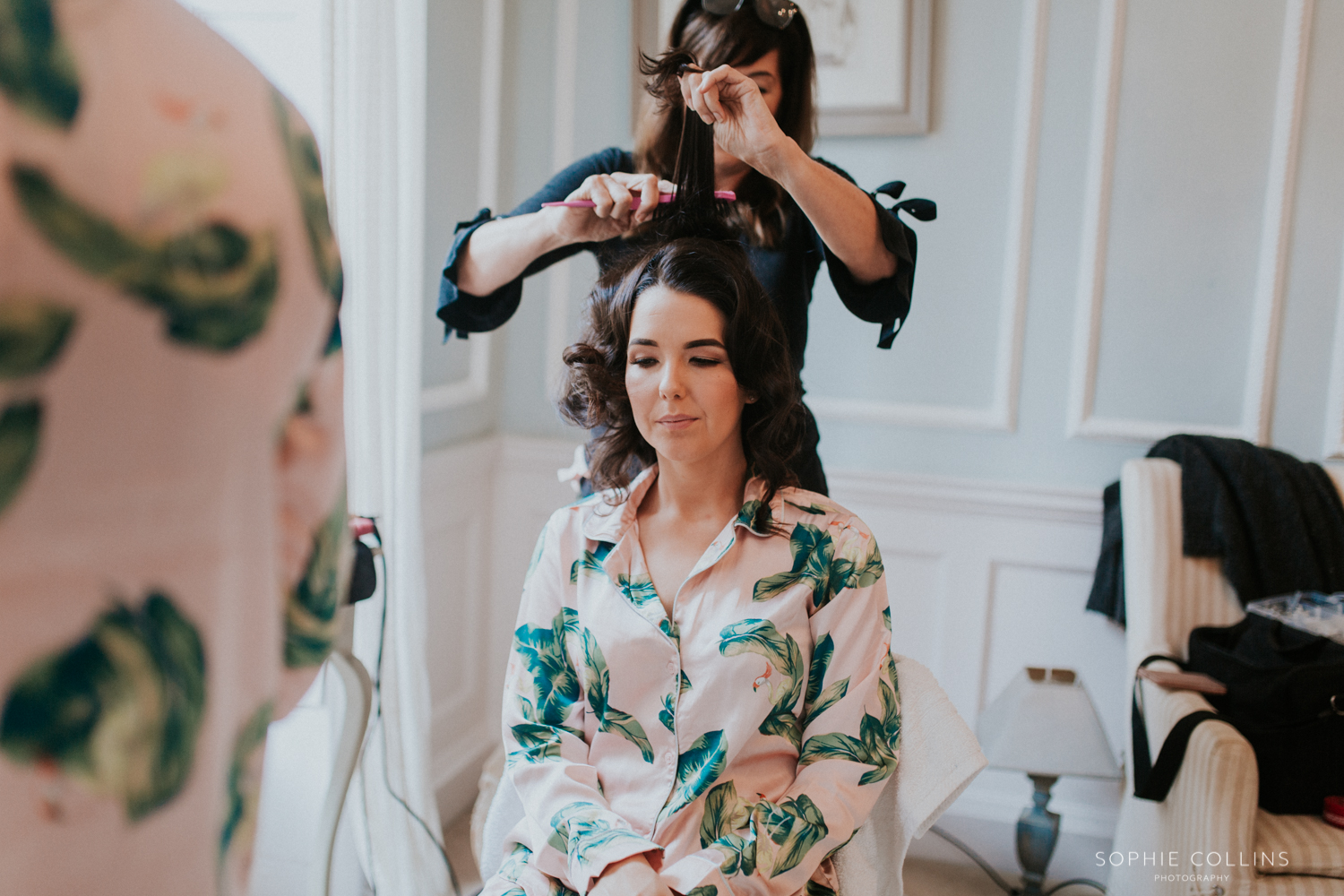 bridesmaid having her hair done