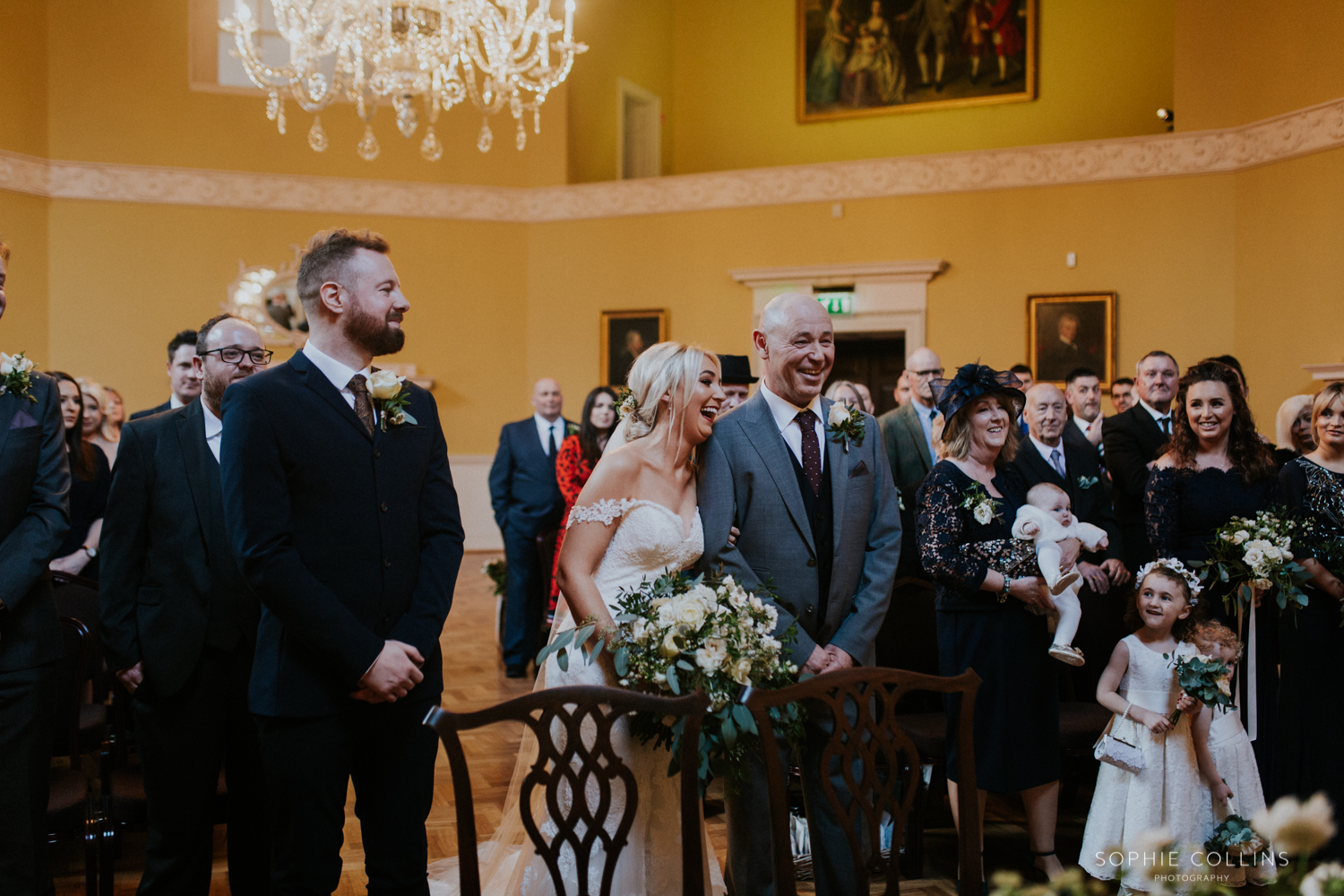 bride laughing with father