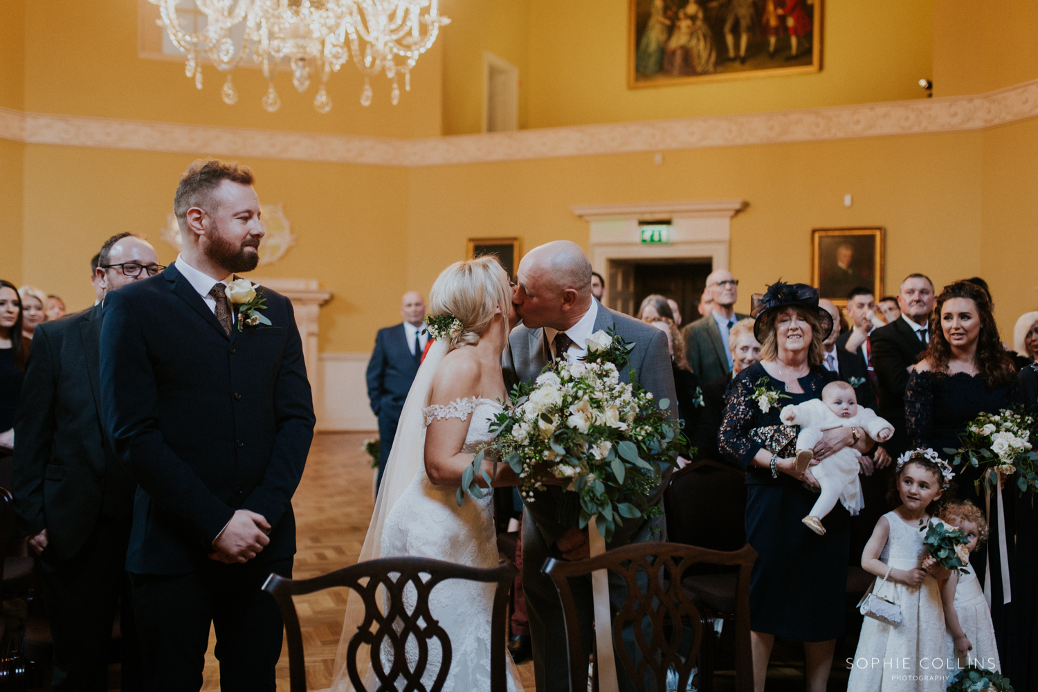 bride kisses her father