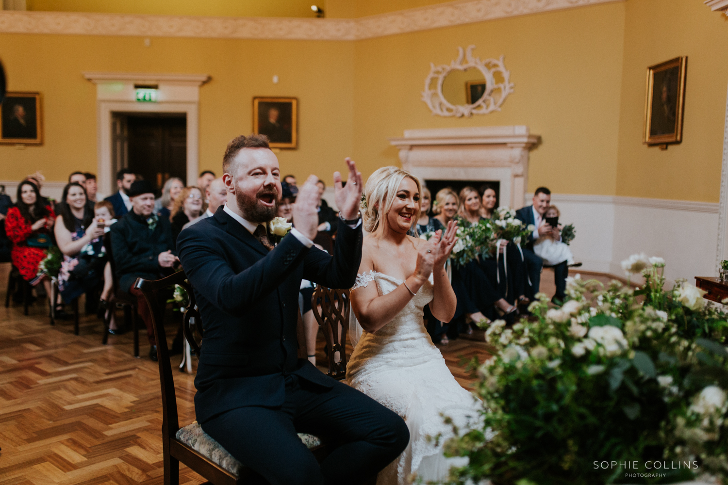 bride and groom clapping 