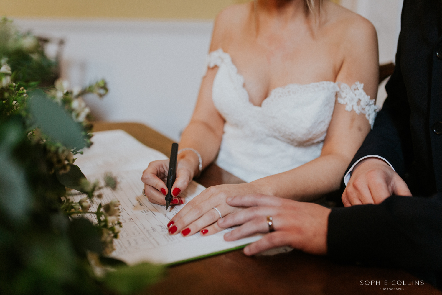 close up signing the register 