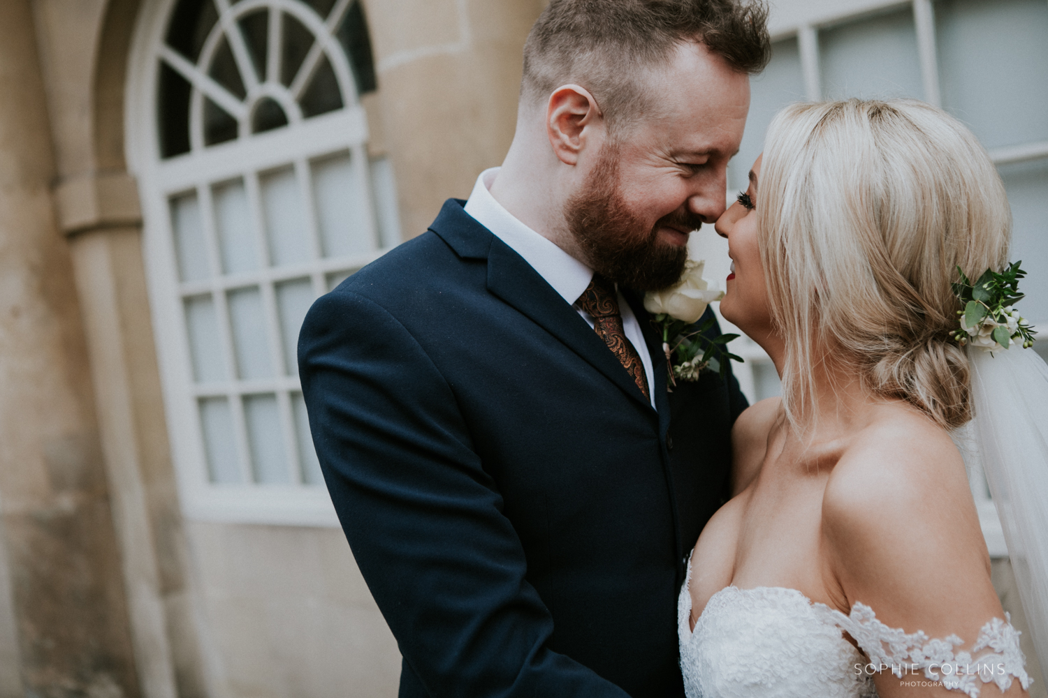 bride and groom smiling 