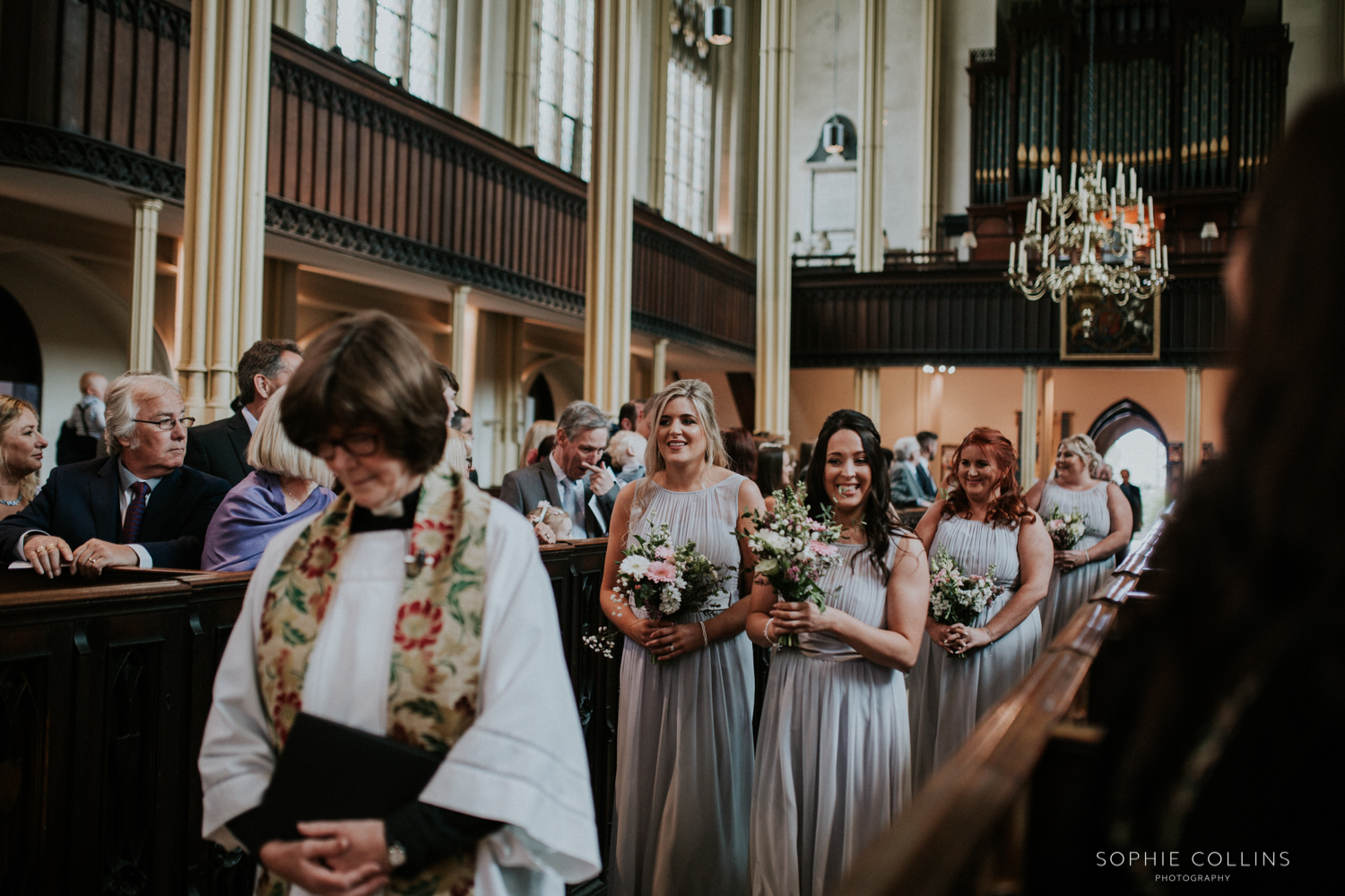 bridesmaids walking down the isle 