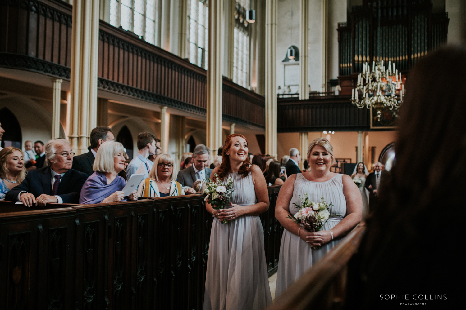 bridesmaids walking down the isle 