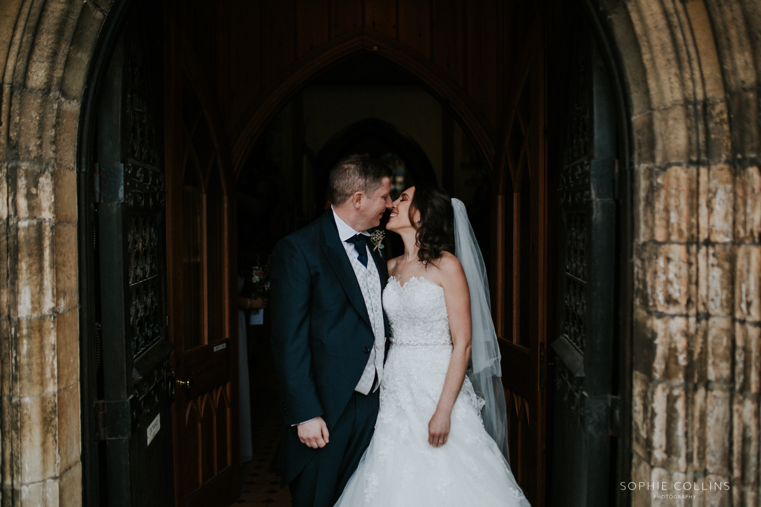 bride and groom outside church 