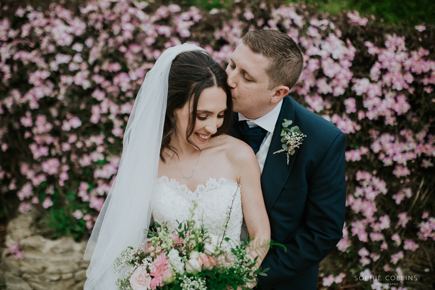 groom kissing bride