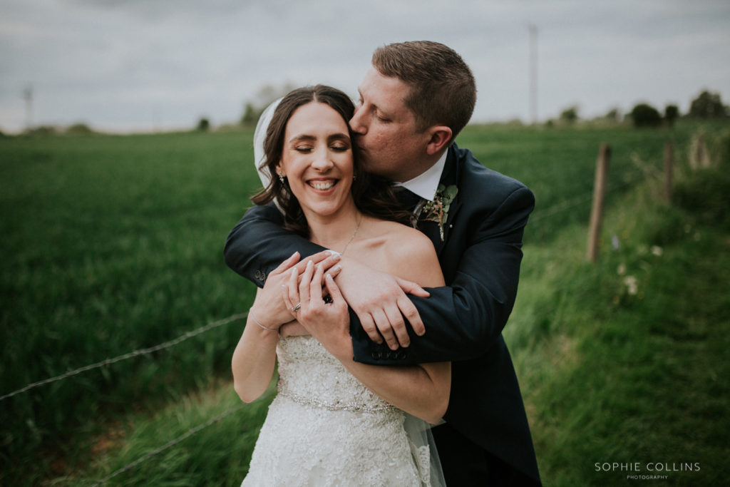 groom kissing bride 