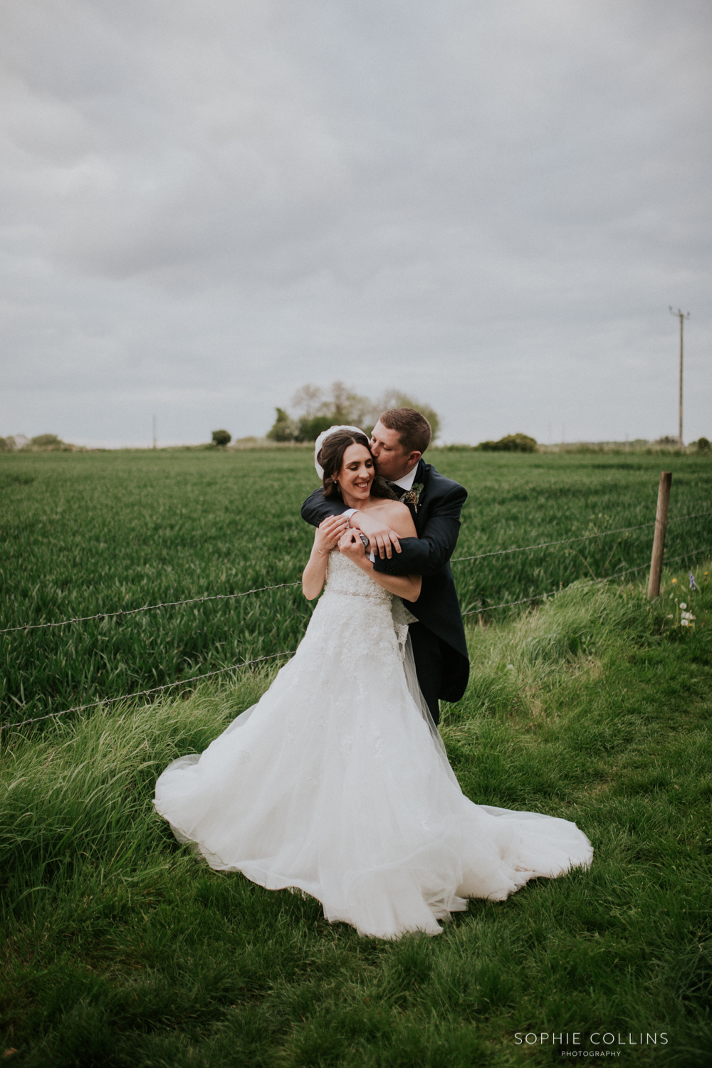 groom kissing bride 