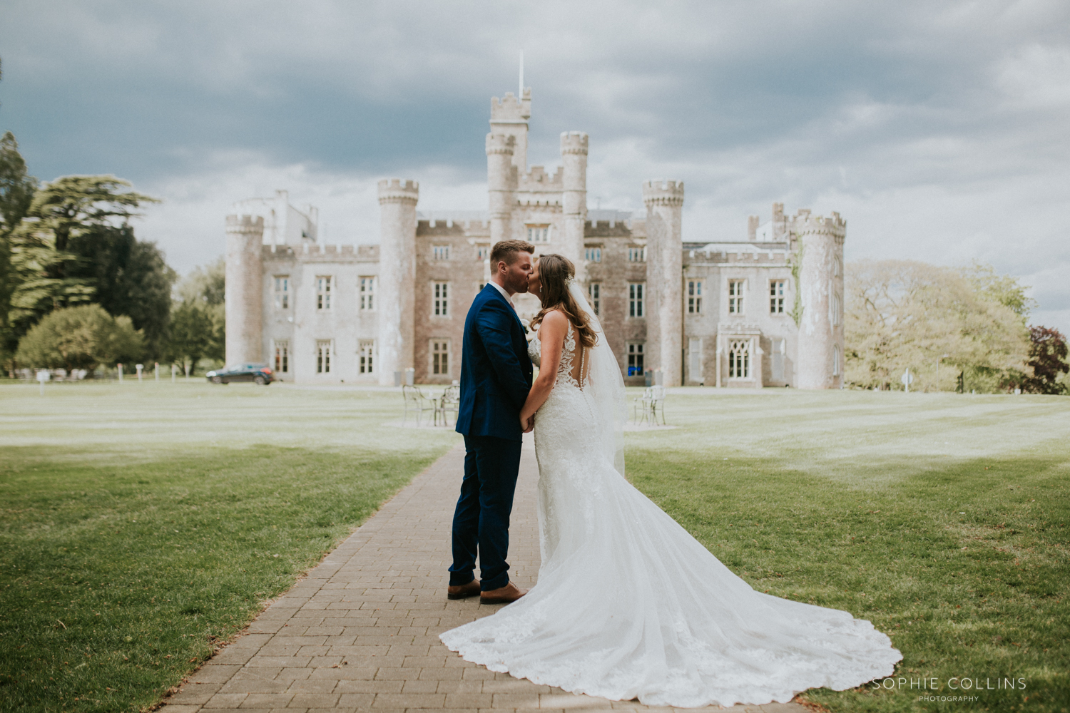 bride and groom outside the castle 